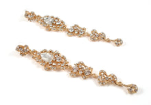 Long length gold earrings